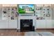 Living room fireplace with built-in shelves and cabinets at 1662 Cascade Dr, Greenwood, IN 46143
