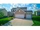 Beautiful two-story home featuring a well-maintained lawn and a spacious driveway leading to a two-car garage at 1662 Cascade Dr, Greenwood, IN 46143