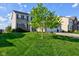 Beautifully landscaped front yard with a mature shade tree accenting this two-story home at 1662 Cascade Dr, Greenwood, IN 46143