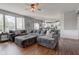 Living room with large windows and a view of the kitchen at 1662 Cascade Dr, Greenwood, IN 46143