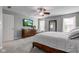 Bright main bedroom features a TV, carpet, and ample natural light at 1662 Cascade Dr, Greenwood, IN 46143