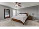 Comfortable main bedroom features a ceiling fan, carpet floors, and a large window at 1662 Cascade Dr, Greenwood, IN 46143
