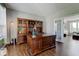 A private office featuring hardwood floors, built-in bookshelves, and a bright, airy feel at 1662 Cascade Dr, Greenwood, IN 46143