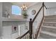 Staircase with white banisters and dark wood railing, leading to the front entrance at 1662 Cascade Dr, Greenwood, IN 46143