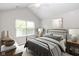 Cozy bedroom with a metal bed frame, nightstands, and a bright window at 16637 Brownstone Ct, Westfield, IN 46074