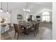 Open concept dining area with pendant lighting flowing into the living room and kitchen at 16637 Brownstone Ct, Westfield, IN 46074