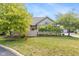 Charming home featuring well-manicured lawn, mature trees, and stone accents create inviting curb appeal at 16637 Brownstone Ct, Westfield, IN 46074