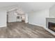 Spacious living room with a fireplace and open floor plan to the kitchen at 16637 Brownstone Ct, Westfield, IN 46074