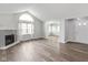 Bright and spacious living room boasting hardwood floors and a cozy fireplace at 16637 Brownstone Ct, Westfield, IN 46074