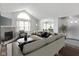 Inviting living room with fireplace, large window, and plush seating offers a comfortable atmosphere at 16637 Brownstone Ct, Westfield, IN 46074