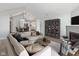 Bright living room featuring fireplace, cabinet, and open floor plan with a kitchen and dining area at 16637 Brownstone Ct, Westfield, IN 46074