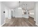 Open concept living space showcasing pendant lighting and white trim at 16637 Brownstone Ct, Westfield, IN 46074