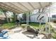 Backyard patio featuring an exercise machine, grill, and trampoline perfect for outdoor enjoyment at 1725 Medford Ave, Indianapolis, IN 46222