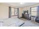 Cozy bedroom with large dresser and two windows, offering a comfortable retreat for rest and relaxation at 1725 Medford Ave, Indianapolis, IN 46222