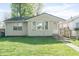 Cozy one-story home featuring a well-maintained lawn and inviting front entrance at 1725 Medford Ave, Indianapolis, IN 46222