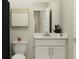 Bright bathroom with white vanity, granite countertop, decorative plant, and modern fixtures at 176 Brunson St, Westfield, IN 46074
