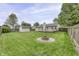 Inviting backyard with well-maintained lawn, deck, storage shed and a cozy fire pit area at 17752 Sanibel Cir, Westfield, IN 46062