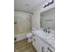 Updated bathroom with white cabinets, marble countertops, and shower-tub combination at 17752 Sanibel Cir, Westfield, IN 46062