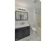 Updated bathroom features a double sink vanity, modern fixtures, and marble flooring at 17752 Sanibel Cir, Westfield, IN 46062