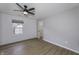 This stylish bedroom boasts wood floors, a ceiling fan, a window, and a closet at 17752 Sanibel Cir, Westfield, IN 46062