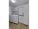 A clean and functional laundry room includes a sink, cabinets, and modern washer and dryer at 17752 Sanibel Cir, Westfield, IN 46062