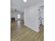 Spacious living room with wood floors, fireplace, and open doorway to a laundry room at 17752 Sanibel Cir, Westfield, IN 46062