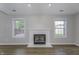 Cozy living room with fireplace and two windows providing natural light at 17752 Sanibel Cir, Westfield, IN 46062