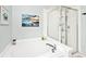Bright bathroom featuring a soaking tub and glass door shower at 19185 Rioux Grove Ct, Noblesville, IN 46062