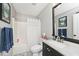 Clean bathroom featuring a shower, toilet, vanity, and mirror at 19185 Rioux Grove Ct, Noblesville, IN 46062