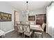 Elegant dining room with a chandelier, wooden table and chairs, and stylish decor at 19185 Rioux Grove Ct, Noblesville, IN 46062