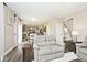 Spacious living room flowing into the kitchen, with hardwood floors and plenty of natural light at 19185 Rioux Grove Ct, Noblesville, IN 46062