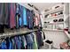Organized walk-in closet with shelves and hanging racks for efficient storage at 19185 Rioux Grove Ct, Noblesville, IN 46062