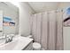 Bright bathroom features a shower, sink, mirror, beach themed decor at 19437 Astoria Ave, Sheridan, IN 46069
