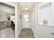 Welcoming entryway with neutral walls, wood-look floors, coat closet, and decorative niche at 19437 Astoria Ave, Sheridan, IN 46069
