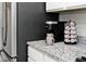 Kitchen detail showcasing granite countertops, stainless steel appliances, and a coffee station at 19437 Astoria Ave, Sheridan, IN 46069