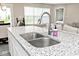 Close up of the kitchen island featuring a stainless steel sink with a modern faucet at 19437 Astoria Ave, Sheridan, IN 46069