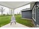 Charming patio space with manicured lawn and a view of the water tower at 19437 Astoria Ave, Sheridan, IN 46069