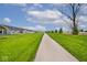Paved walking path featuring the neighborhood and lush green space at 19437 Astoria Ave, Sheridan, IN 46069