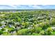 Peaceful residential area with tree-lined streets, well-spaced houses, and lush green lawns, ideal for Gathering living at 195 Lake Dr, Greenwood, IN 46142