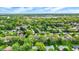 Lush green neighborhood with mature trees, well-kept lawns, and various home styles, offering a serene community atmosphere at 195 Lake Dr, Greenwood, IN 46142