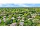 Spacious neighborhood featuring a mix of home styles, mature trees, and well-manicured lawns, enhanced by a community pool at 195 Lake Dr, Greenwood, IN 46142