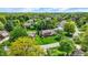 Brick home in neighborhood with mature trees, with spacious green lawn, and neatly maintained landscaping at 195 Lake Dr, Greenwood, IN 46142