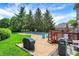 Beautiful backyard with a large pool, patio, and lush landscaping at 195 Lake Dr, Greenwood, IN 46142