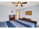 Comfortable bedroom featuring a ceiling fan, carpet, and ample storage with the matching dresser at 195 Lake Dr, Greenwood, IN 46142