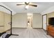 Spacious bedroom with neutral walls, ceiling fan, and access to the hallway at 195 Lake Dr, Greenwood, IN 46142