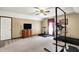 Bonus room featuring ceiling fan, carpet, exercise equipment, and natural light at 195 Lake Dr, Greenwood, IN 46142