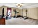 Bonus room featuring ceiling fan, carpet, exercise equipment, and natural light at 195 Lake Dr, Greenwood, IN 46142