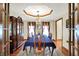 Formal dining room showcasing hardwood floors, a chandelier, and an elegant table setting for sophisticated meals at 195 Lake Dr, Greenwood, IN 46142