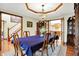 Classic dining room with hardwood floors, a chandelier, and a spacious table perfect for Gathering dinners at 195 Lake Dr, Greenwood, IN 46142