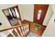 Inviting foyer with hardwood floors, decorative front door and staircase at 195 Lake Dr, Greenwood, IN 46142